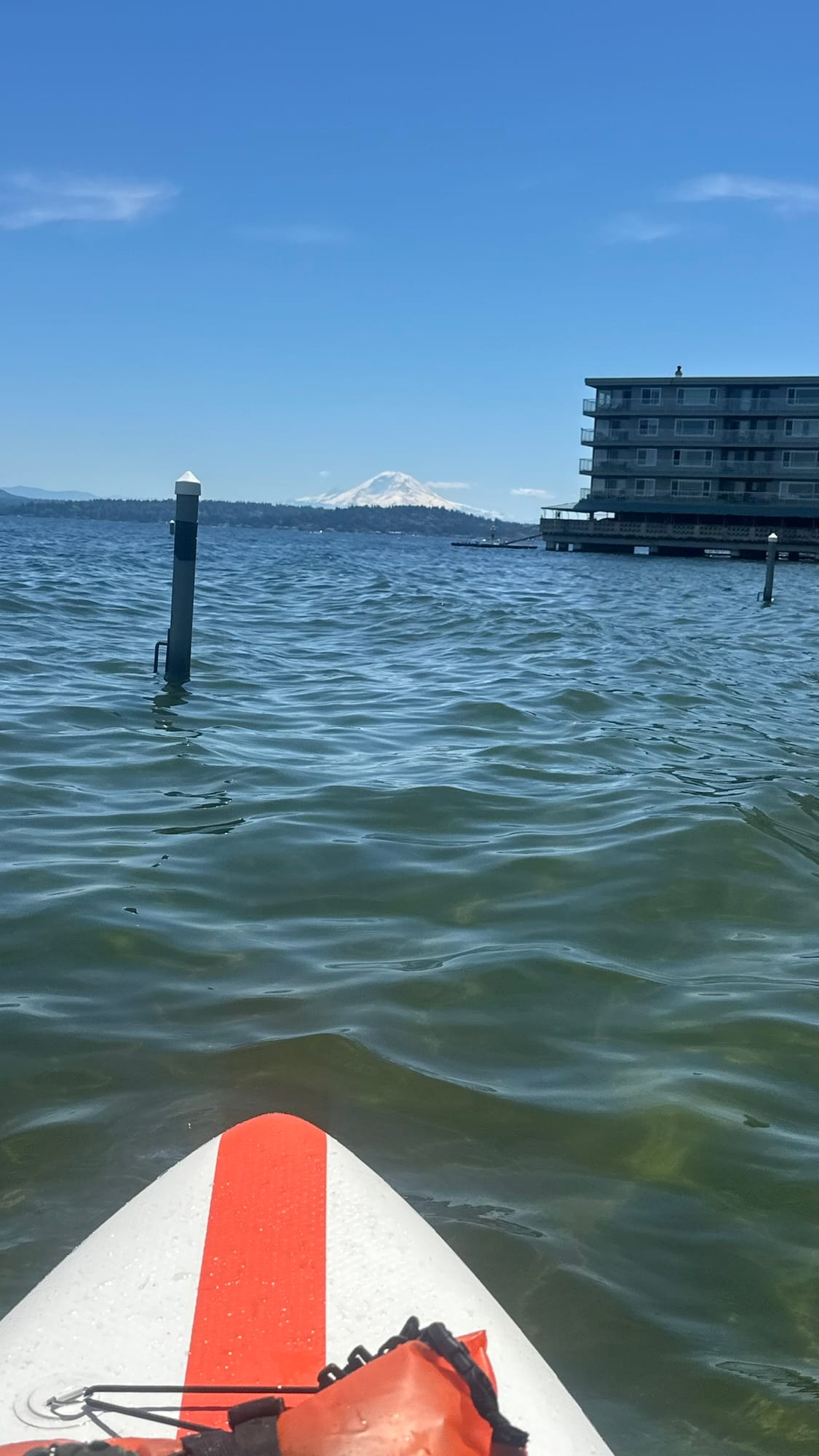 View from the nose of my paddleboard looking out at Lake Washington with Rainier behind