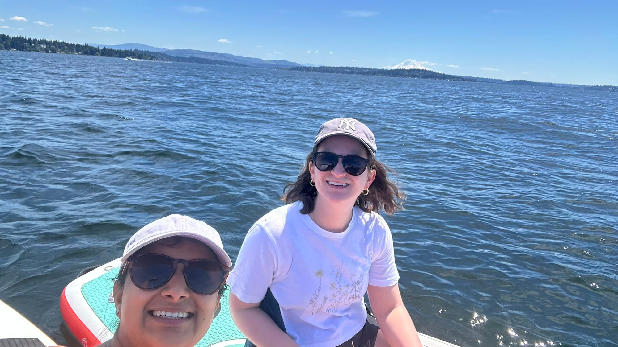 Selfie with Leah on paddleboards with Rainier visible in the background