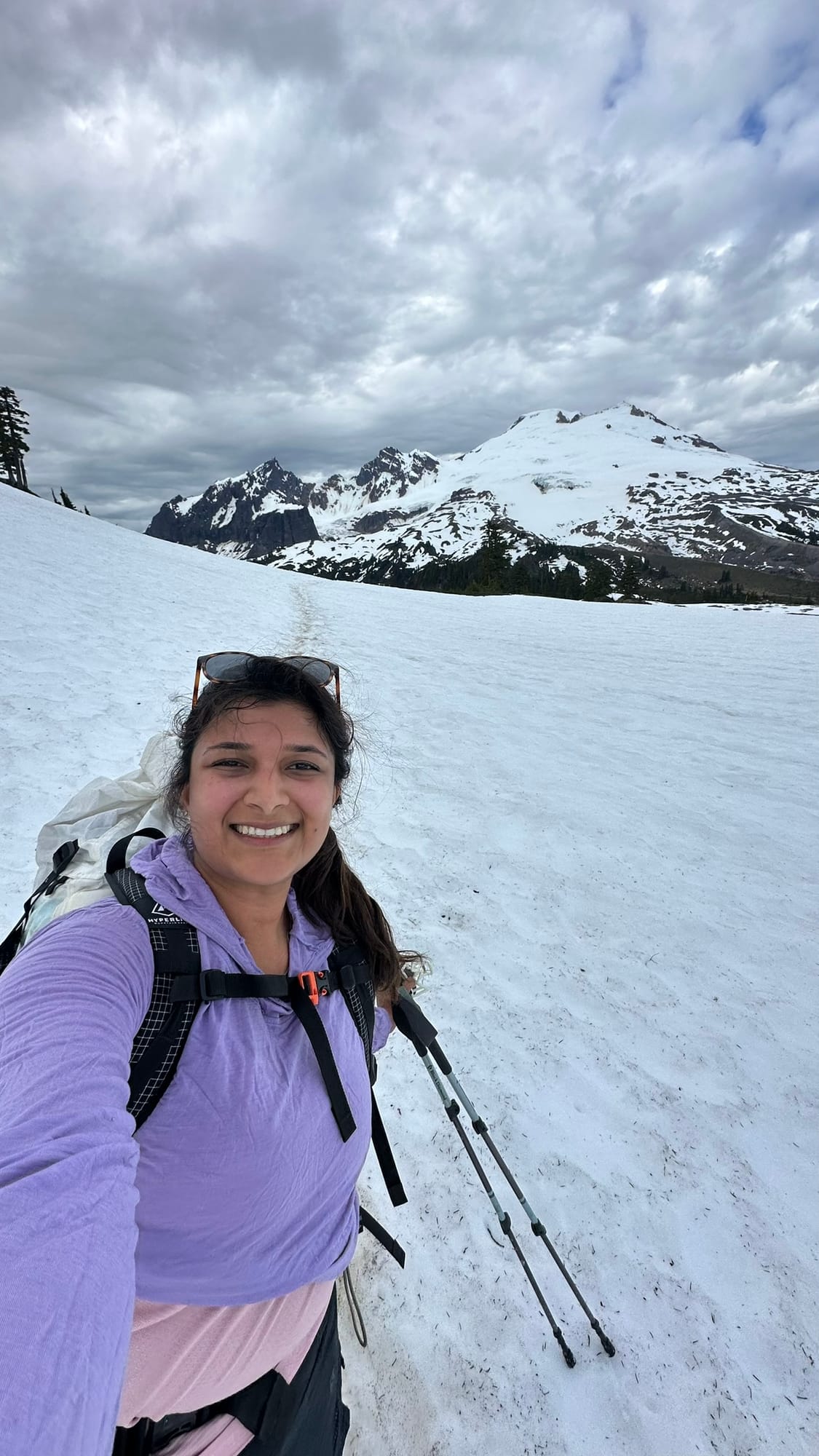 Descending the snow field in the morning with Baker and surrounding peaks