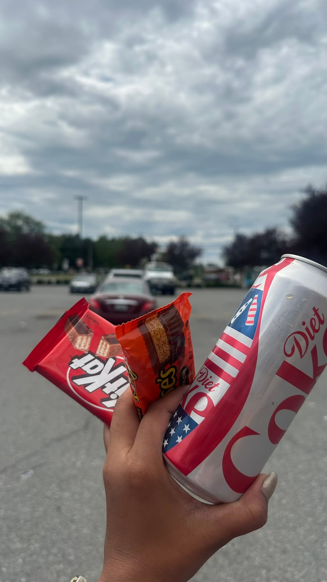 Kit Kat, Reese's, and a Diet Coke in a gas station parking lot — pre-hike fuel