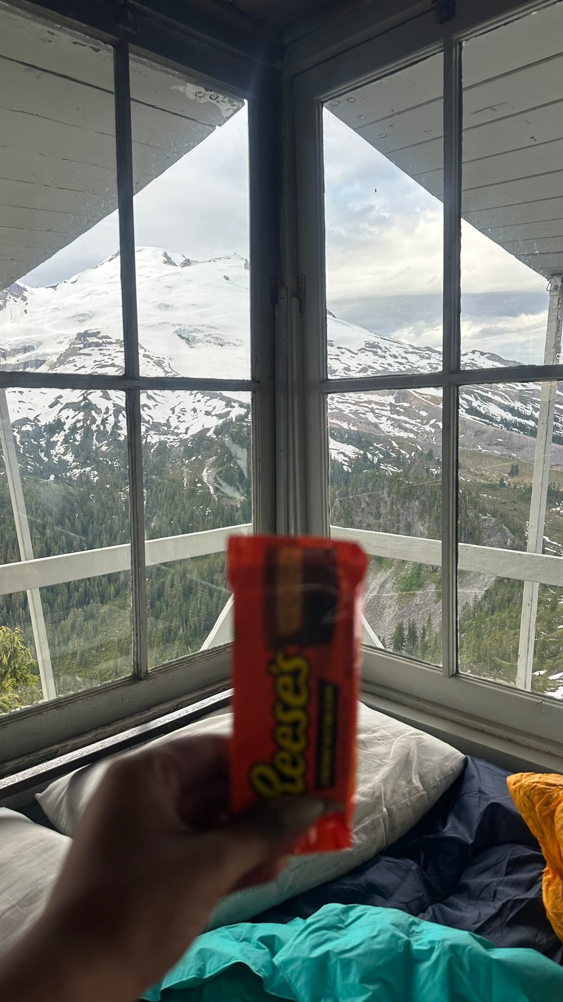 Reese's Peanut Butter Cups held up to the Baker corner window