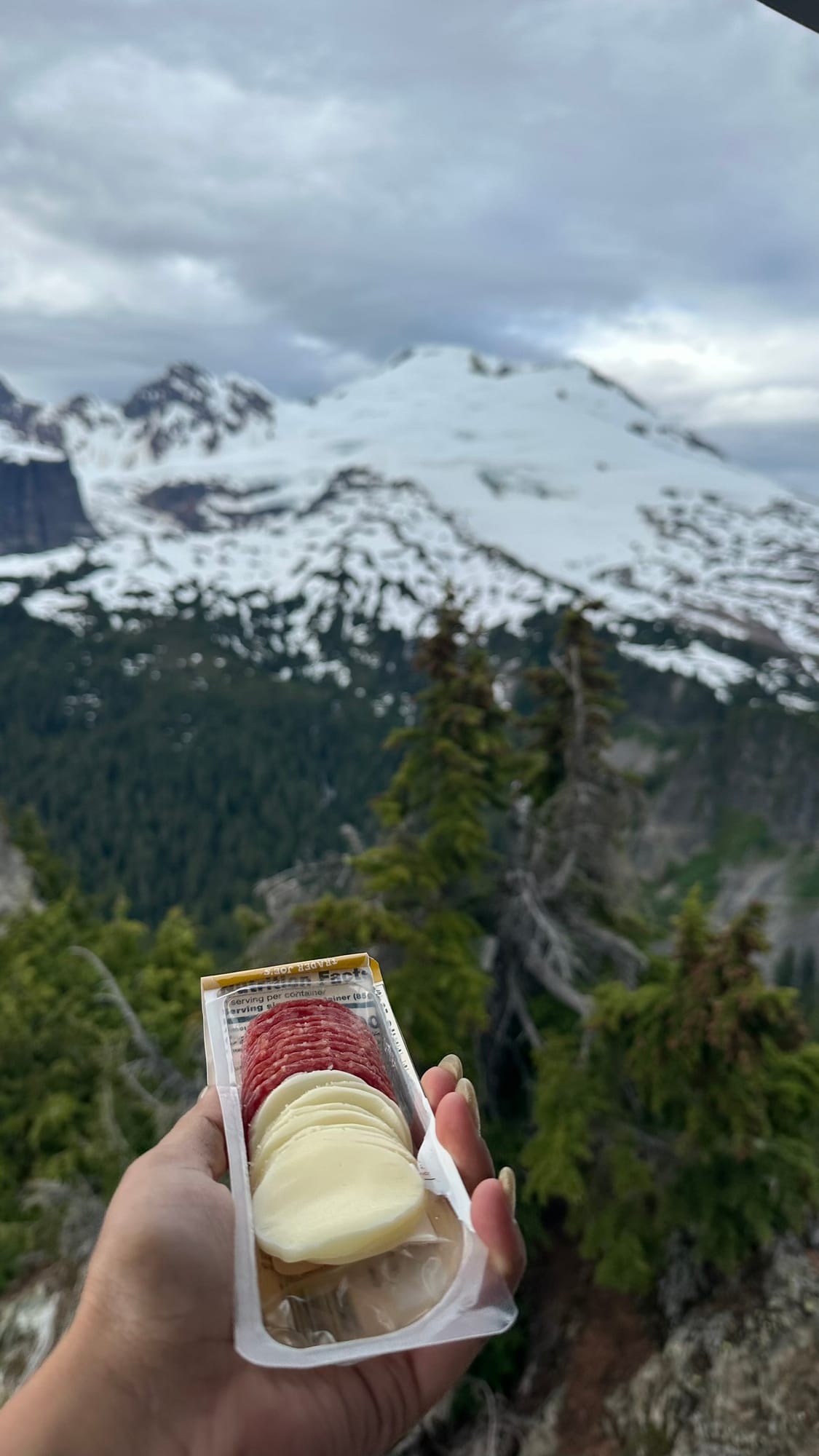 Salami and cheese with the lookout in the background
