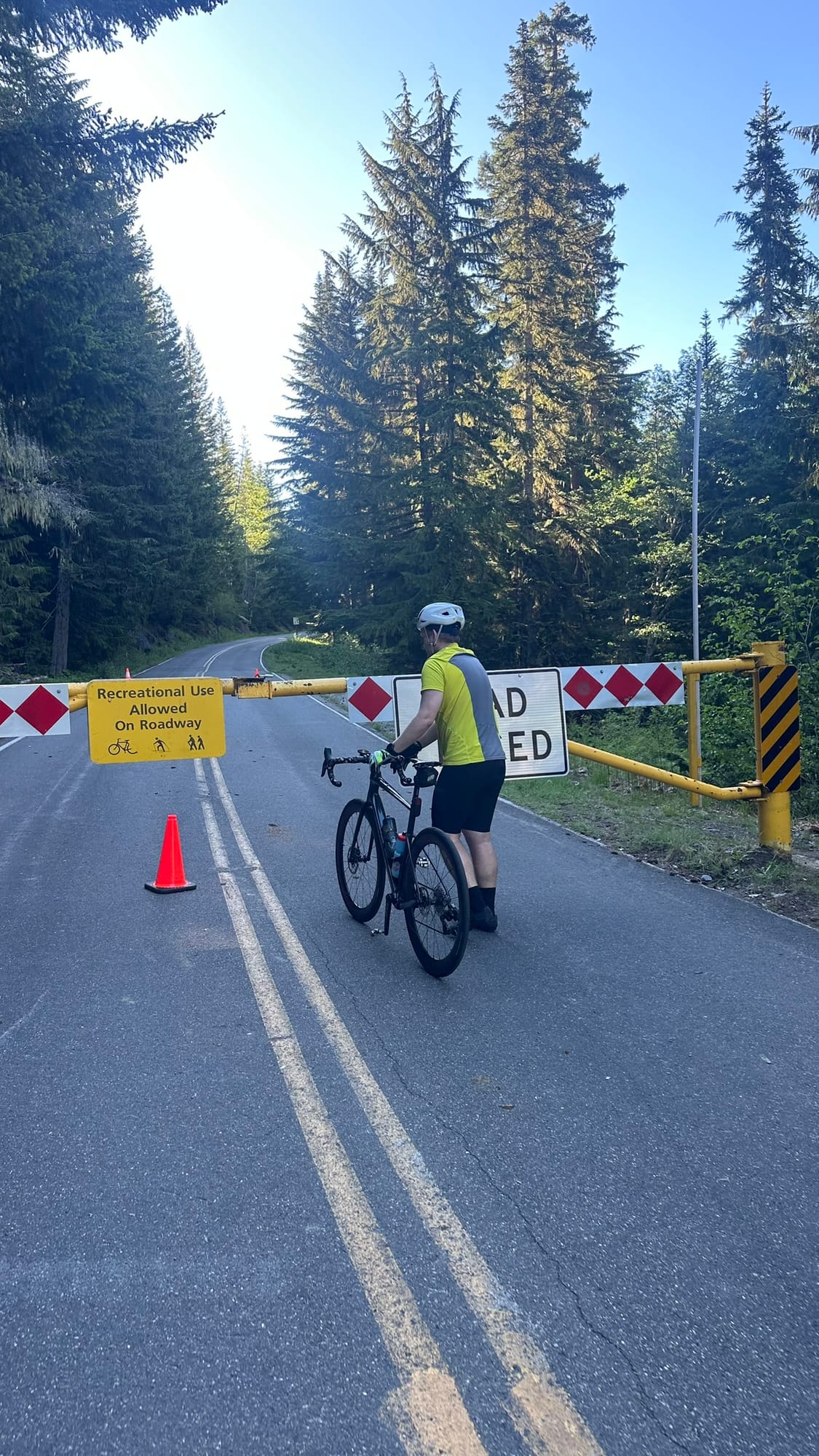 Gate sign: Recreational Use Allowed on Roadway, with friend at the bottom of the closed road