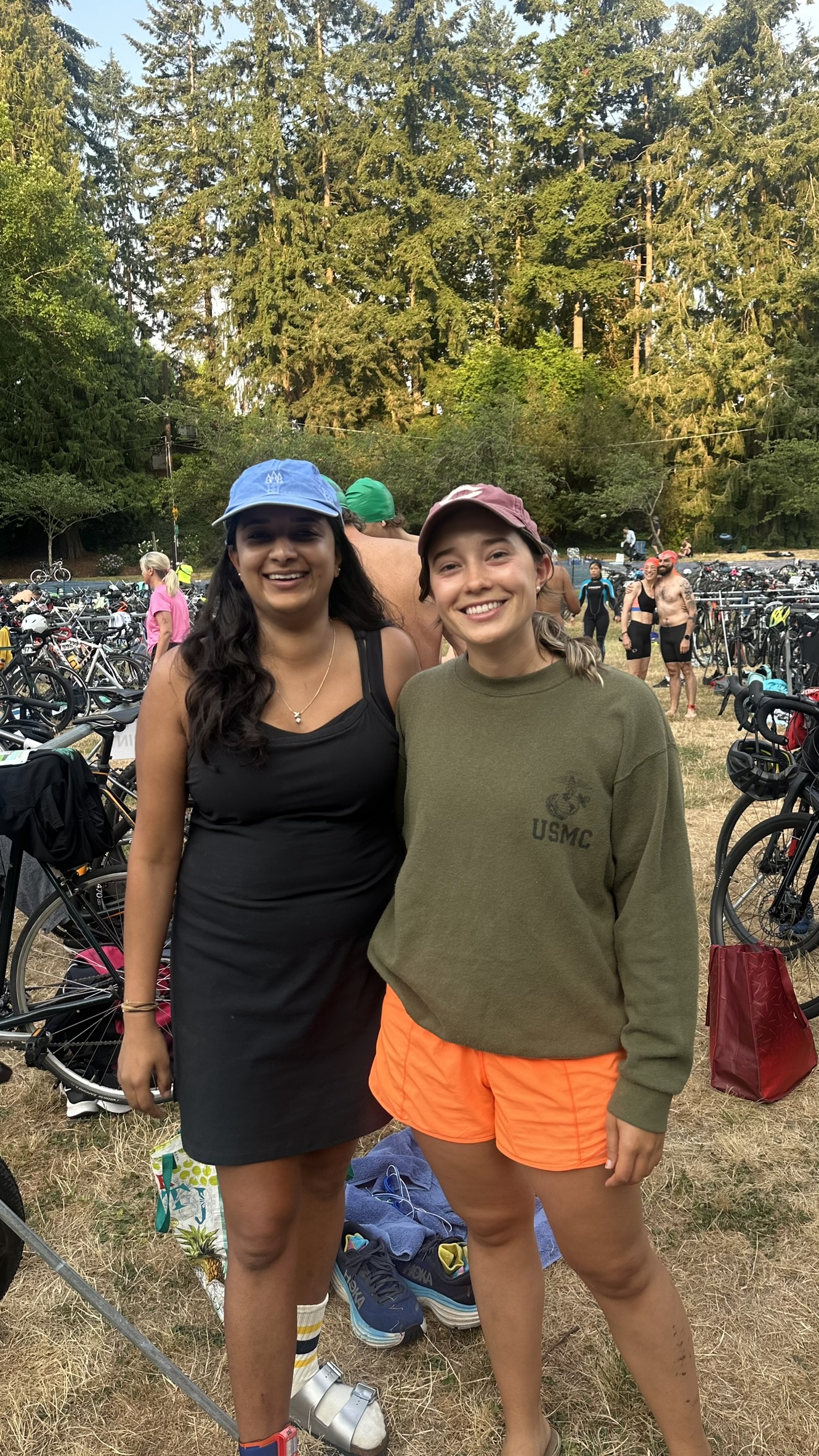 Saachi and a friend at the Seward Park transition zone, bikes racked behind, before the race